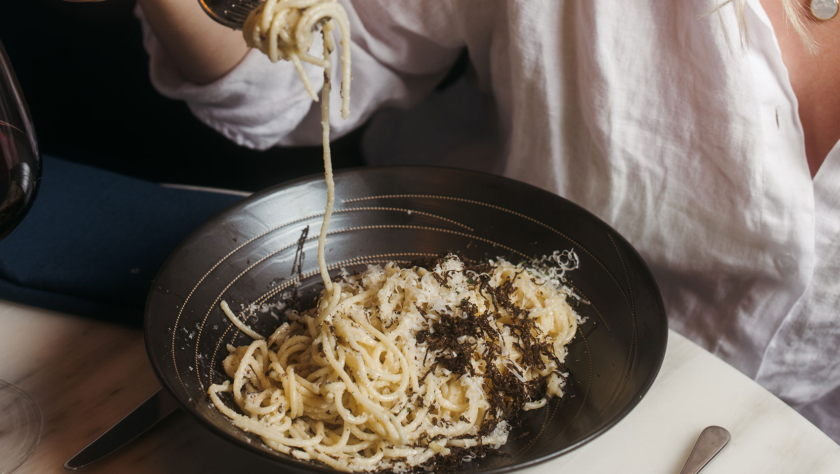 woman with pasta at cavalier san antonio