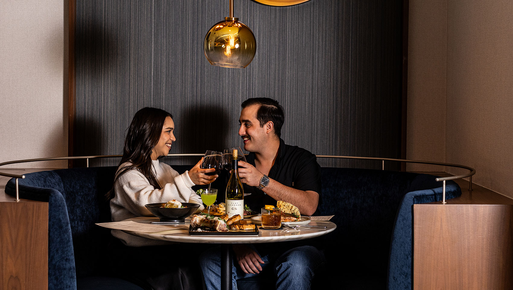 couple cheersing at cavalier