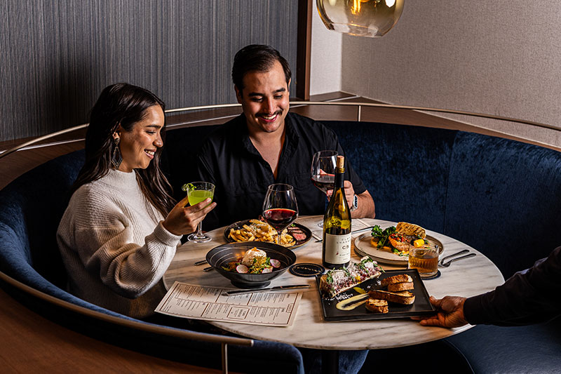 couple enjoying a meal at Cavalier 2